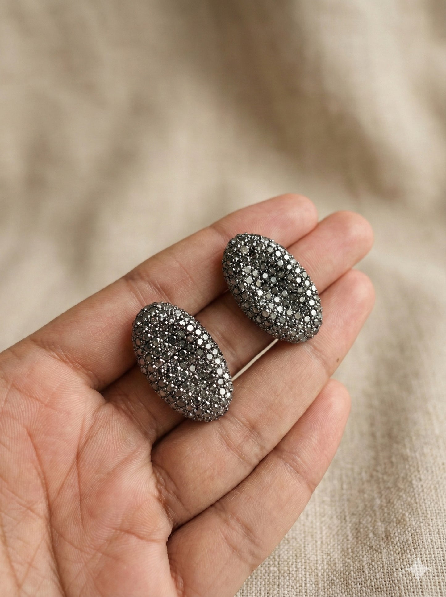 Oval Shaped Gray Finish Earrings studded with small crystals